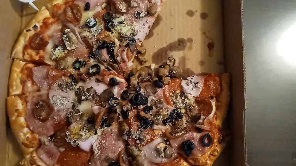 All Meat Plus Mushroom and Olive Pizza